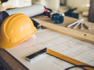 hard hat and building plans